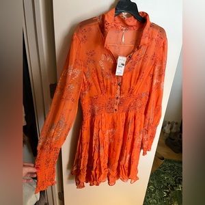 Size M Free People dress with original tags.